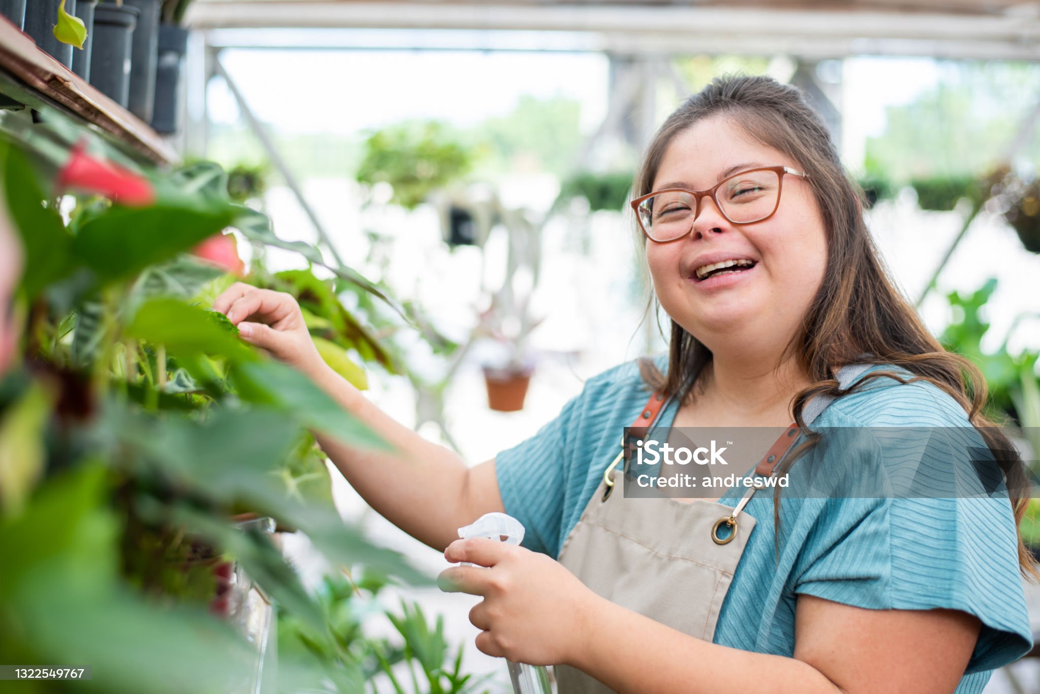 woman with down syndrome florist working in flower shop